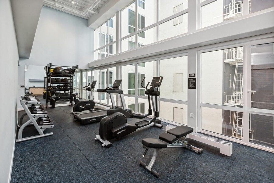 Fitness center with weightlifting equipment at TL Residences