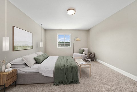 Model Bedroom with Carpet and Window View at Heights at Marlborough Apartments located in Marlborough, MA.