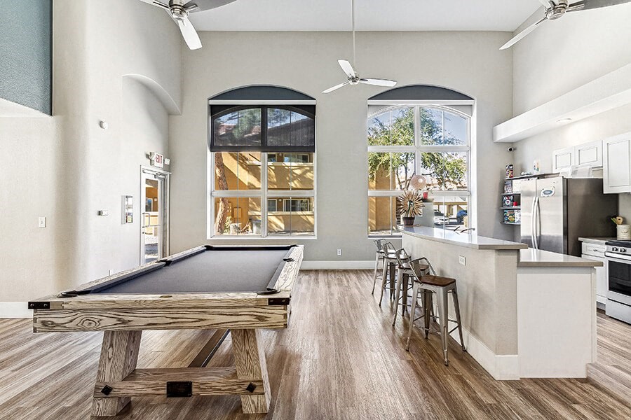 Community Clubhouse with Kitchenette and Pool Table at Topaz Springs Apartments in Las Vegas, NV.