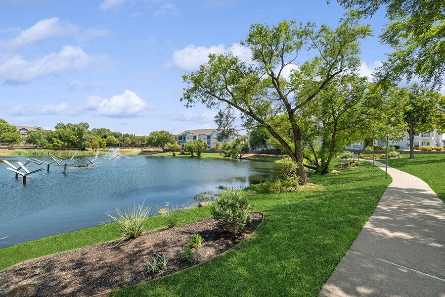 Community Pond with Fountain at Essence Apartments in Dallas, TX.