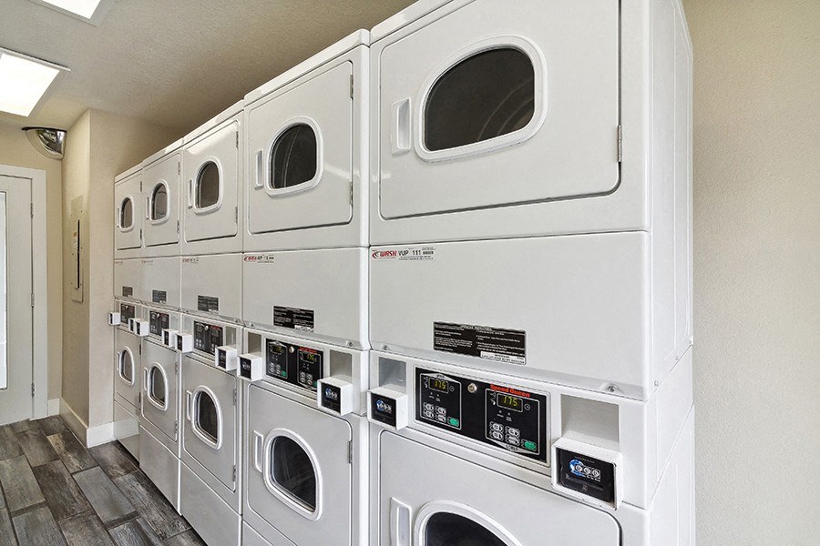 Community Laundry Center with Washing Machines and Dryers at Meadow Ridge Apartments in Las Vegas, NV.