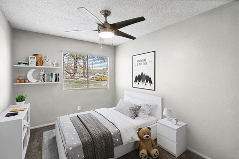 Apartments for Rent in South Tucson, AZ - Solano Springs - A Bedroom With A White Bed, Nightstand, Ceiling Fan, Floating Shelves, Framed Art, And Window With Blinds.