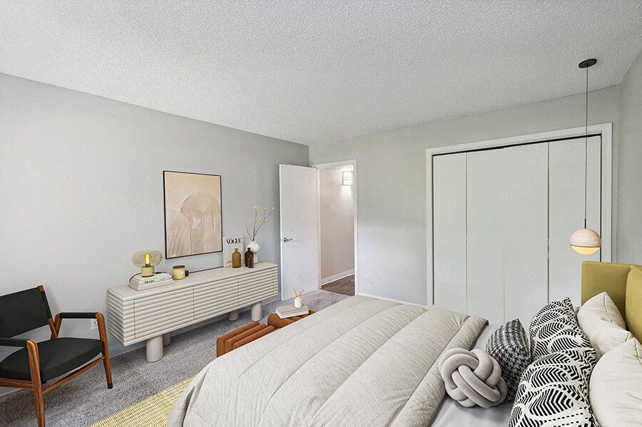 Model Bedroom with Carpet and Closet at Indigo Park Apartments located in Albuquerque, NM.