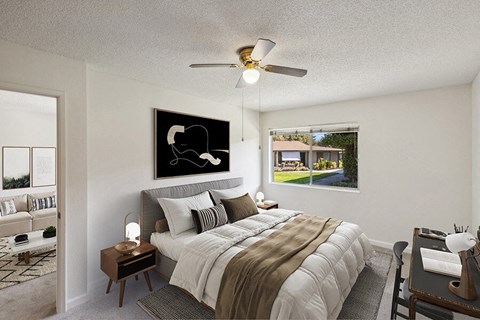 Model Bedroom with Carpet and Window View at Walnut Creek Apartments located in Walnut Creek, CA.
