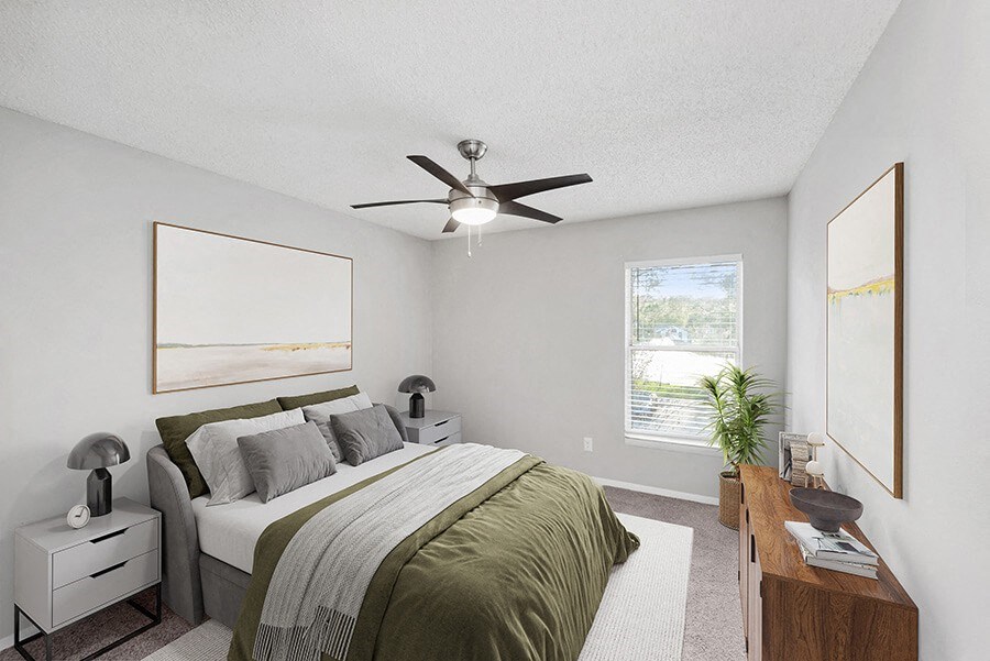 Model Bedroom with Carpet and Window View at Vue at Baymeadows Apartments in Jacksonville, FL.