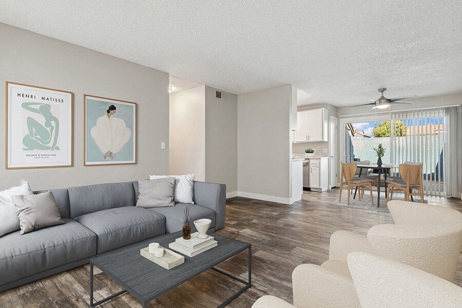 Model Living Room with Wood-Style Flooring at Peaks on 4th Apartments in Avondale, AZ.