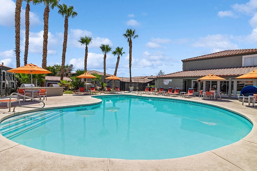 Community Swimming Pool with Pool Furniture at Loma Vista Apartments in Las Vegas, NV.