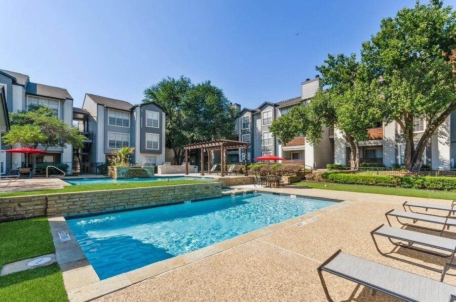 Poolside cabanas and lounge chairs at Cobblestone, Arlington, TX