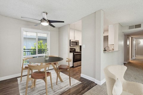 an open kitchen and dining room with a table and chairs