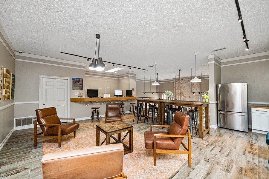 Community Clubhouse Upstairs with Island Counter and Lounge Furniture at Dallas North Park Apartments in Dallas, TX.