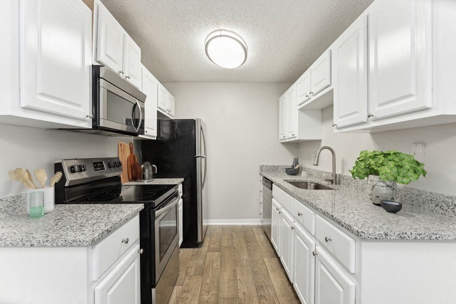 Model kitchen with white cabinets