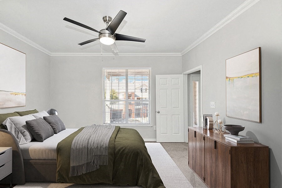 Model Bedroom with Carpet and Window View at Chapel Hill Apartments in Lewisville, TX.