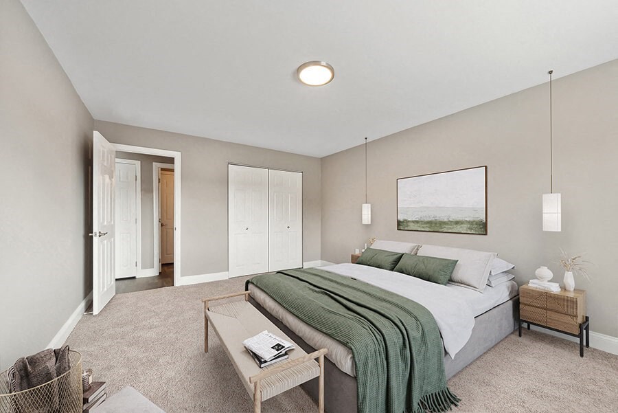 Model Bedroom with Carpet and Closet  at Heights at Marlborough Apartments located in Marlborough, MA.