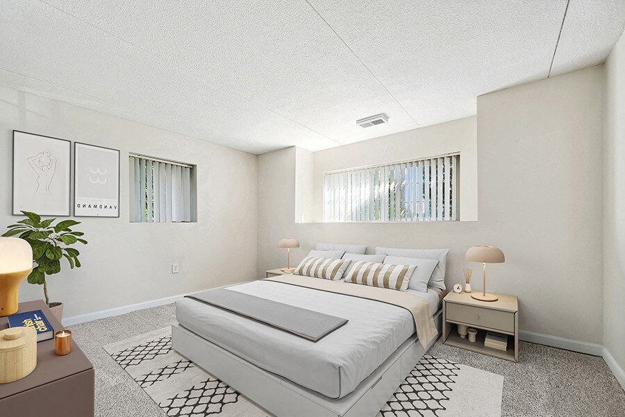Model Bedroom with Carpet and Window View at Heights Marlborough Apartments in Boston, MA.