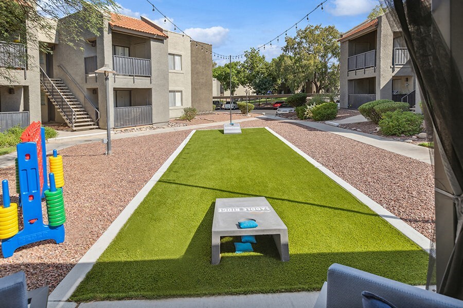 Outdoor Corn Hole Area at Saddle Ridge Apartments in Tucson, AZ.