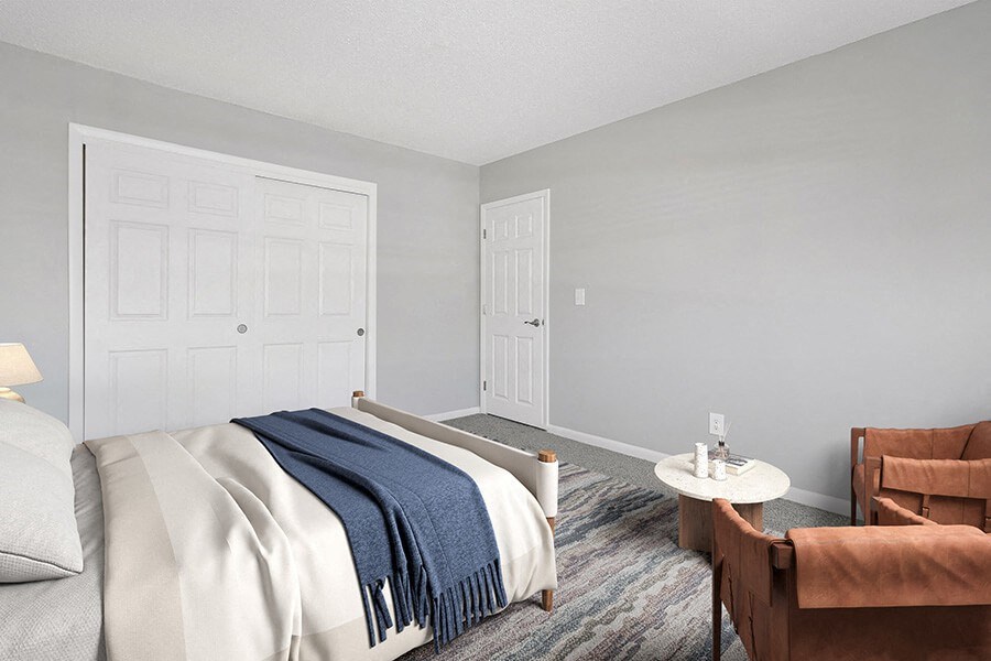 Model Bedroom with Carpet and Closet at Stone Ends Apartments in Stoughton, MA.