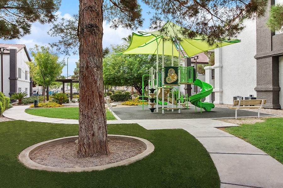 Exterior Landscape and View of Playground at Meadow Ridge Apartments in Las Vegas, NV.