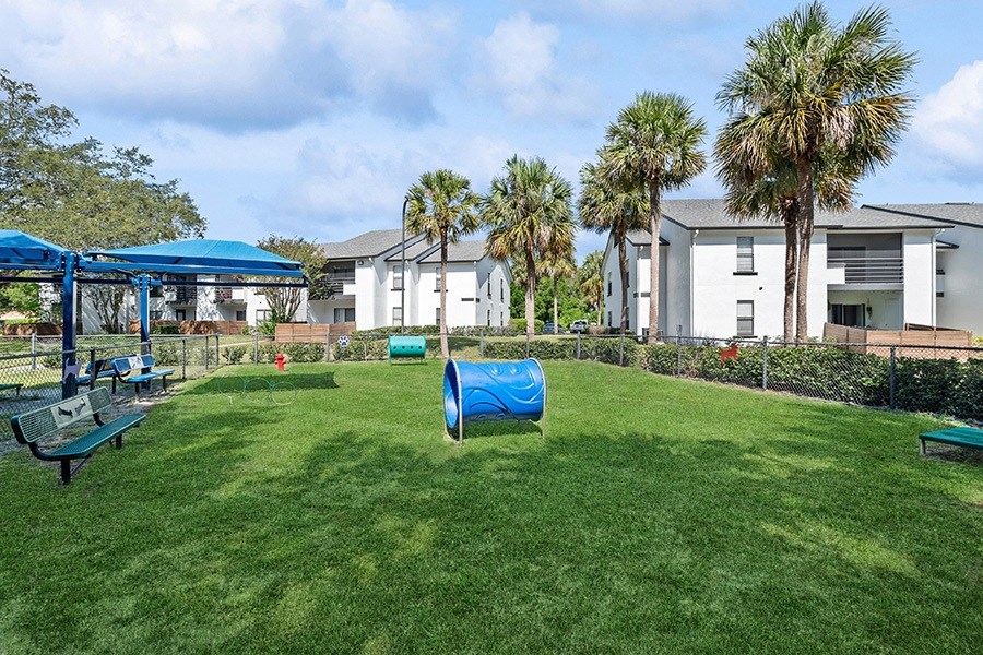 Community Dog Park with Agility Equipment at Rosehill Preserve Apartments in Orlando, FL.