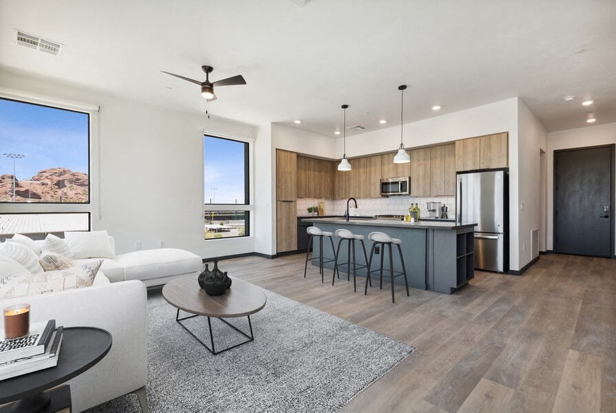 Model living room and kitchen with large window