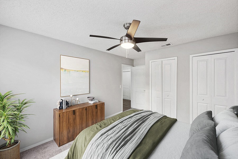 Model Bedroom with Carpet and Double Closets at Vue at Baymeadows Apartments in Jacksonville, FL.