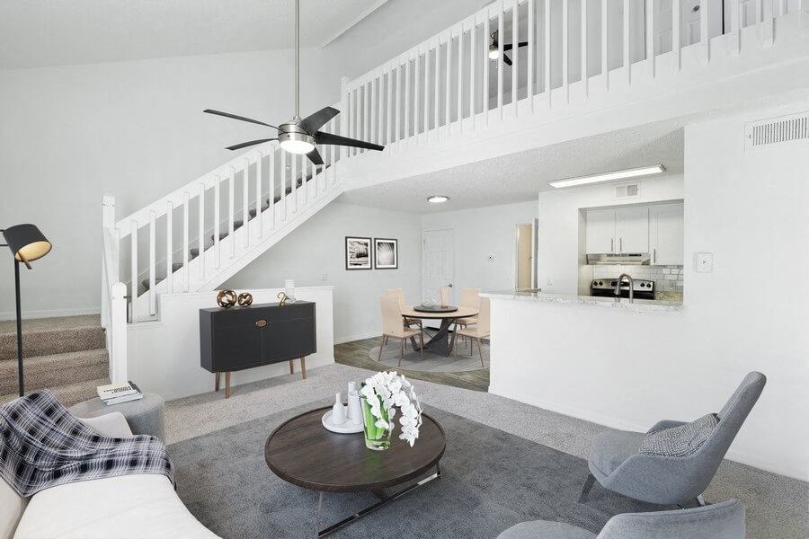 Model living room with staircase to 2nd level