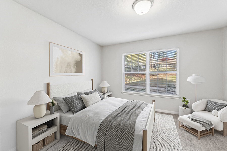 Model Bedroom with Carpet and Window View at Lake Cameron Apartments located in Apex, NC.