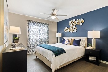 Model bedroom with large window and bright natural lighting - Photo Gallery 5
