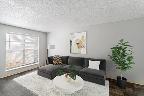 our apartments offer a living room with a couch and a coffee table