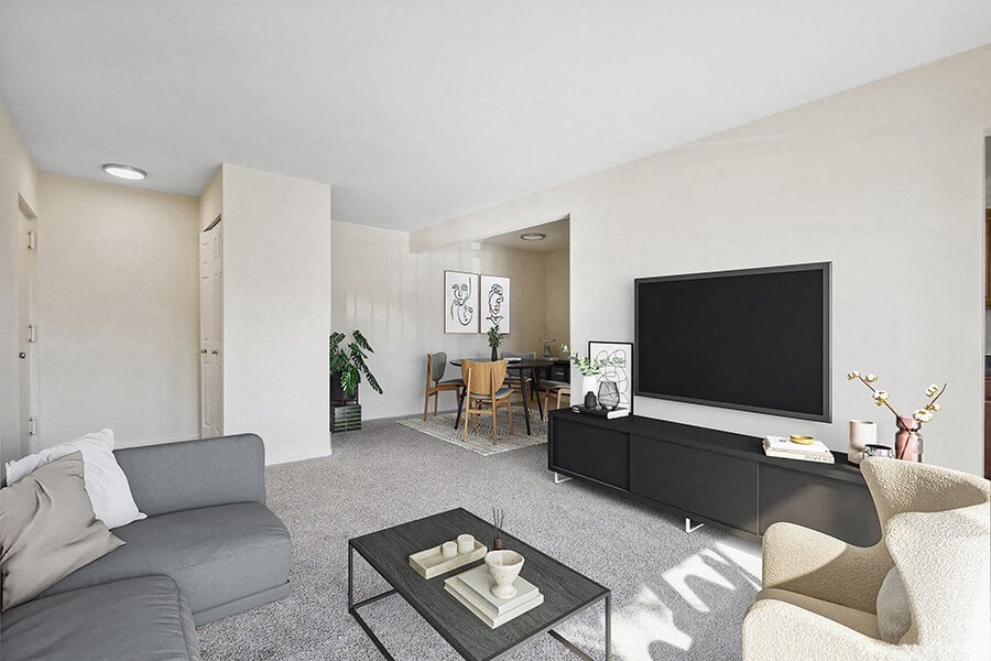 Model Living Room with Carpet and View of Dining Room at Spring Parc Apartments in Silver Spring, MD.