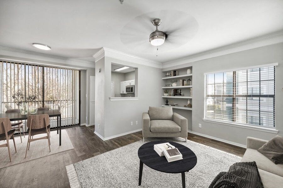 Model living room with patio entrance at Bridges at Oakbend, Texas, 75067