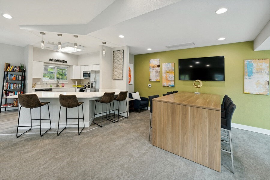 Community Clubhouse with Lounge Furniture and Kitchenette Area at The Club Apartments located in Hillsboro, OR.