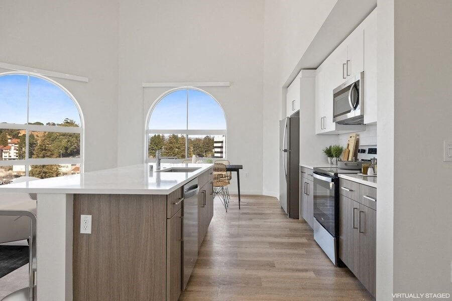Model kitchen with large arch window