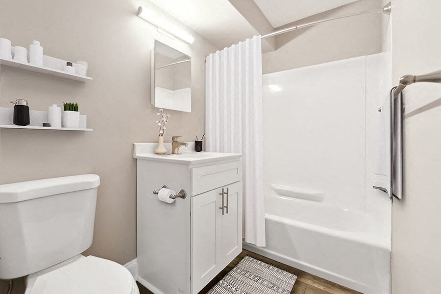 Model Bathroom with White Cabinets, Wood-Style Flooring and Shower/Tub at Heights at Marlborough Apartments located in Marlborough, MA.