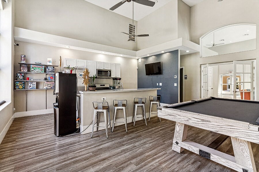 Community Clubhouse with Kitchenette and Pool Table at Topaz Springs Apartments in Las Vegas, NV.