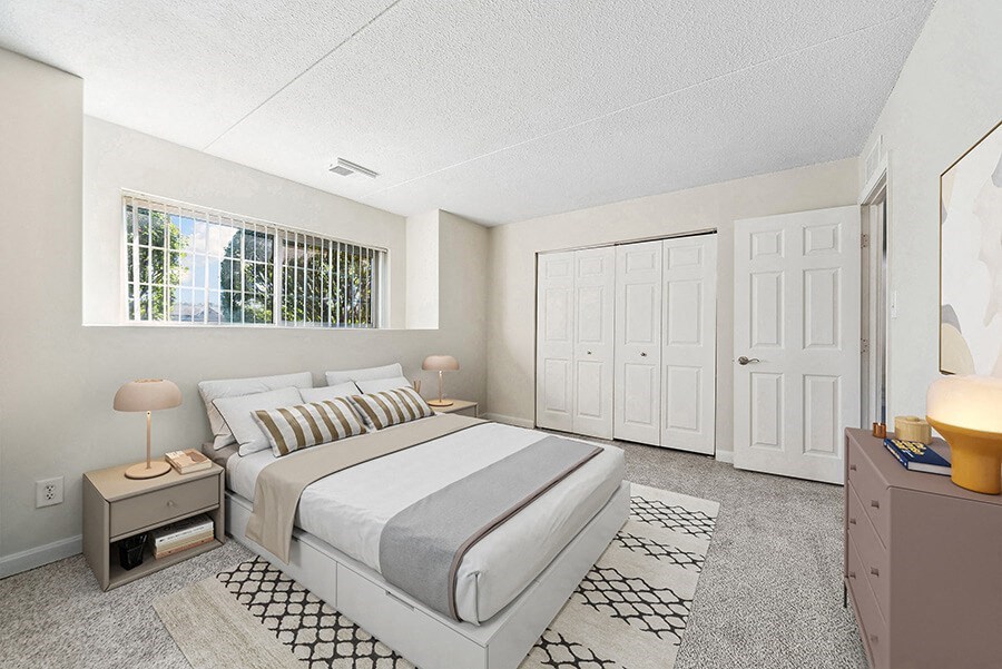 Model Bedroom with Carpet and Closet at Heights Marlborough Apartments in Boston, MA.