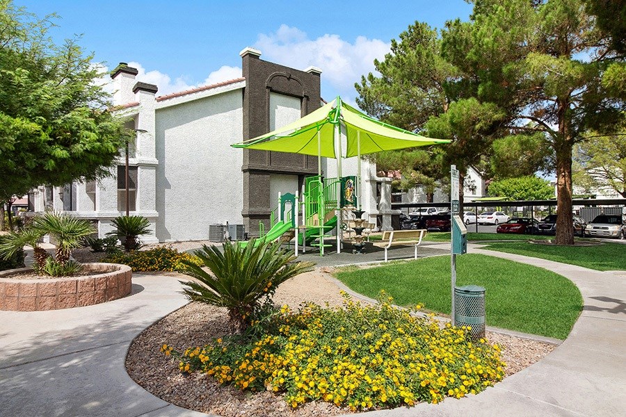 Exterior Landscape and View of Playground at Meadow Ridge Apartments in Las Vegas, NV.