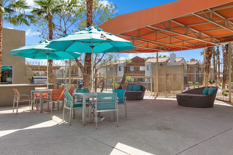 Community Swimming Pool Lounge Furniture & BBQ Area at Stonegate Apartments in Las Vegs, NV.