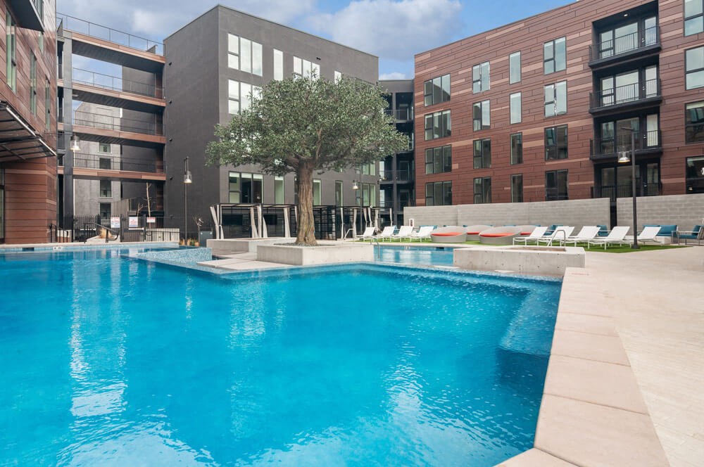 Resort-style, sparkling swimming pool and pool deck area at Post District Residences in Downtown Salt Lake City, Utah