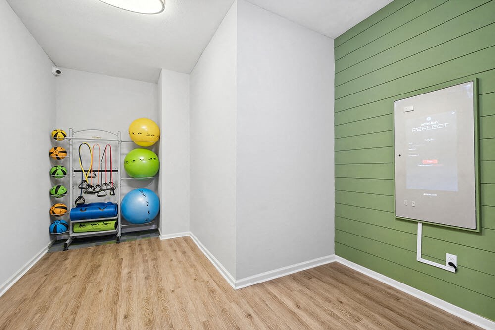 Community Fitness Center with Equipment at Westland Park Apartments in Jacksonville, FL.