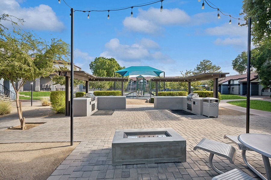 Outdoor Fire Pit Area with Lounge Furniture at Stillwater Apartments located in Glendale, AZ.