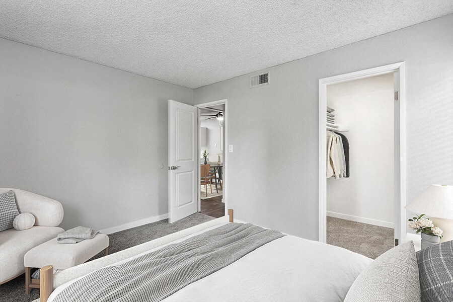 Model Bedroom with Carpet and Closet at The Archer Apartments in Sacramento, CA.