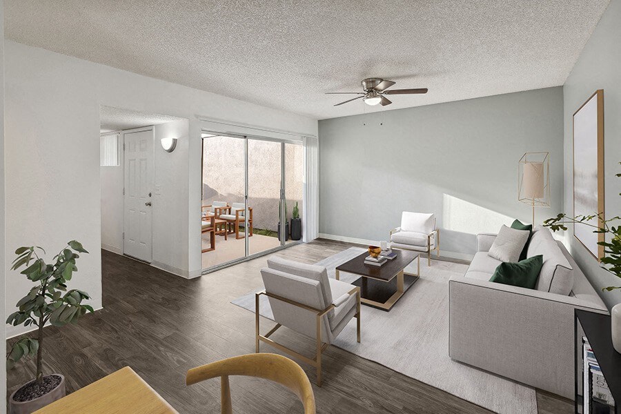 Model Living Room with Wood-Style Flooring and Patio Accessibility at Lakeside Casitas Apartments located in Tucson, AZ.