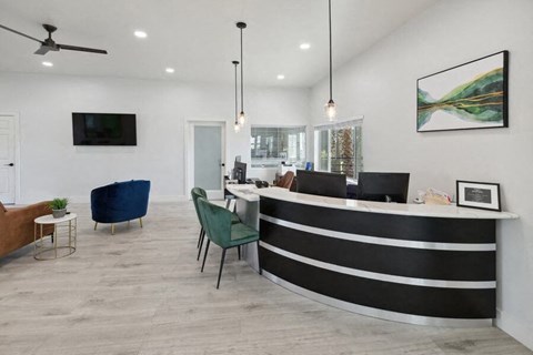 A lobby with a reception desk and chairs  at Lakeside Casitas in Tucson, AZ