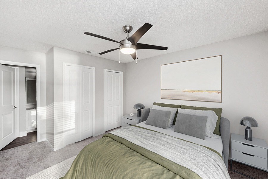 Model Bedroom with Carpet and attached Bathroom at Vue at Baymeadows Apartments in Jacksonville, FL.
