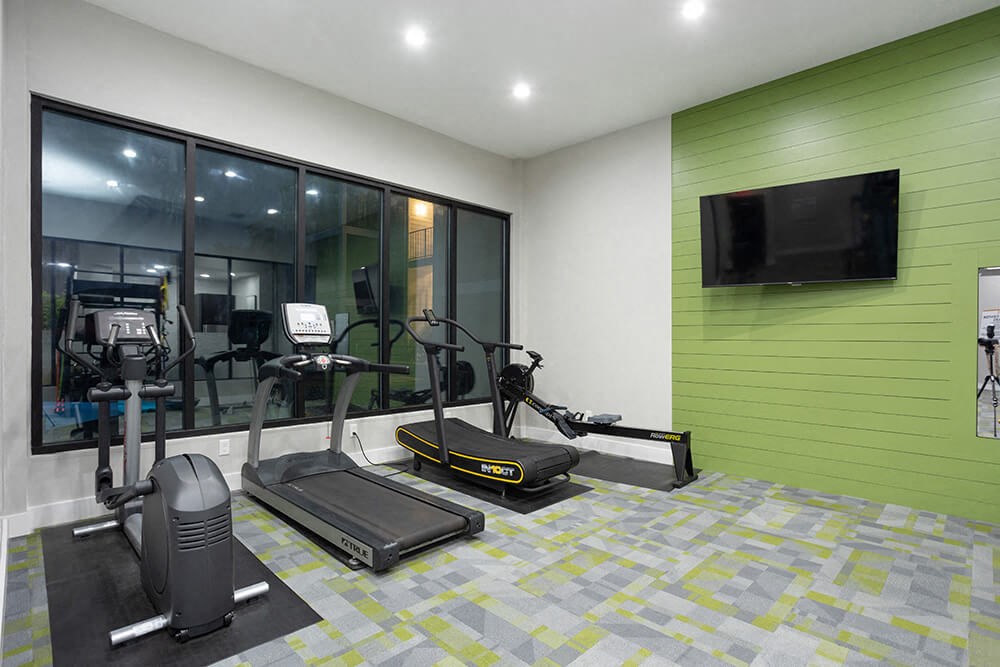 Community Fitness Center with Equipment at Haven at Water's Edge Apartments in Tampa, FL.