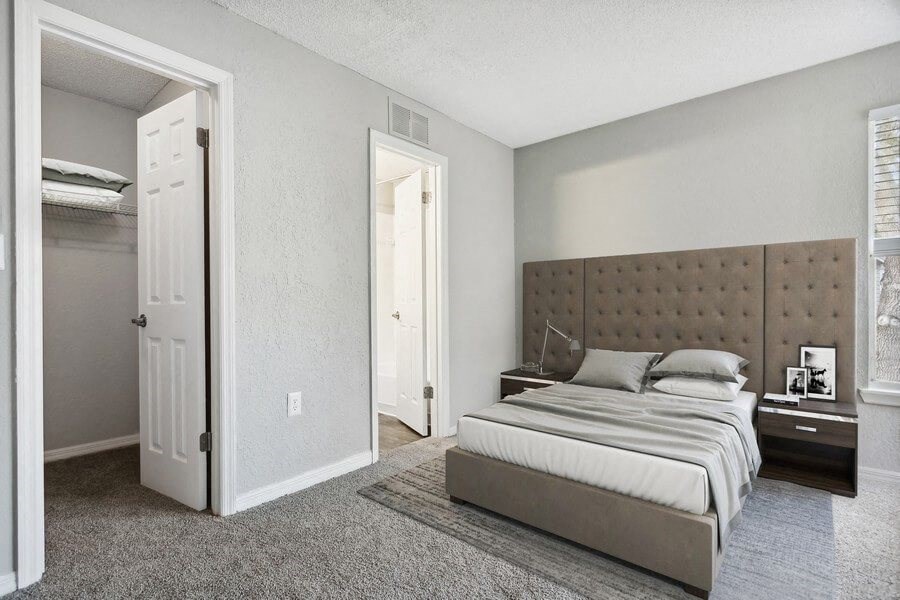 Model bedroom with walk-in closet