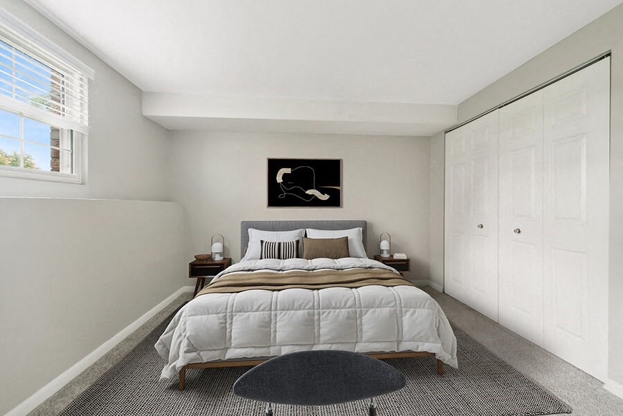 Model Bedroom with Carpet and Closet at Meadows at Marlborough Apartments located in Marlborough, MA.