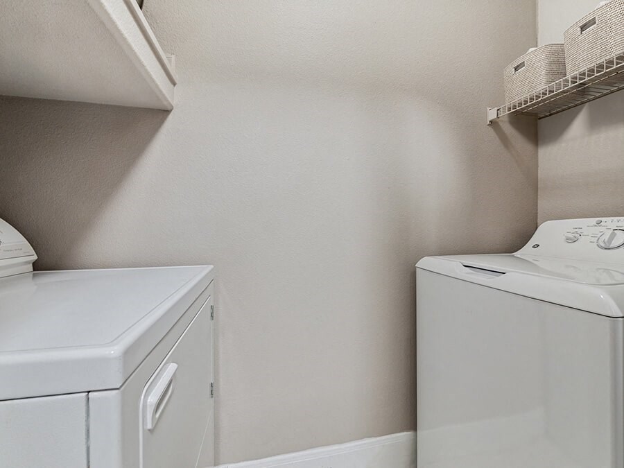 Model Laundry Room with Washer & Dryer at Park West Apartments located in Houston, TX.