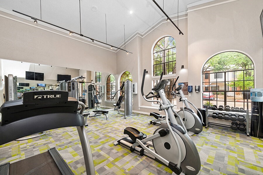 Community Fitness Center with Equipment at Dallas North Park Apartments in Dallas, TX.