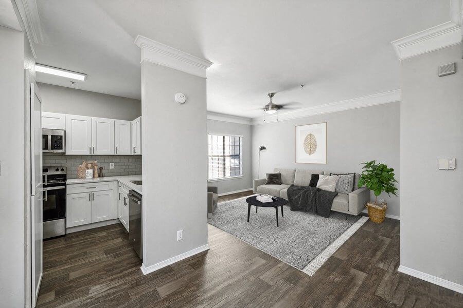 Model living room and kitchen at Bridges at Oakbend, Lewisvillle, TX, 75067
